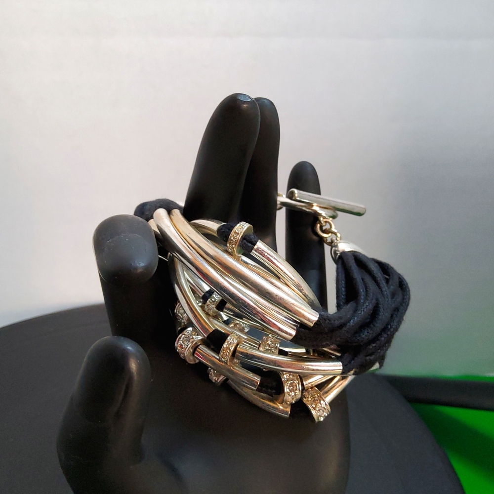 Multi strand Silvertone and cord bracelet